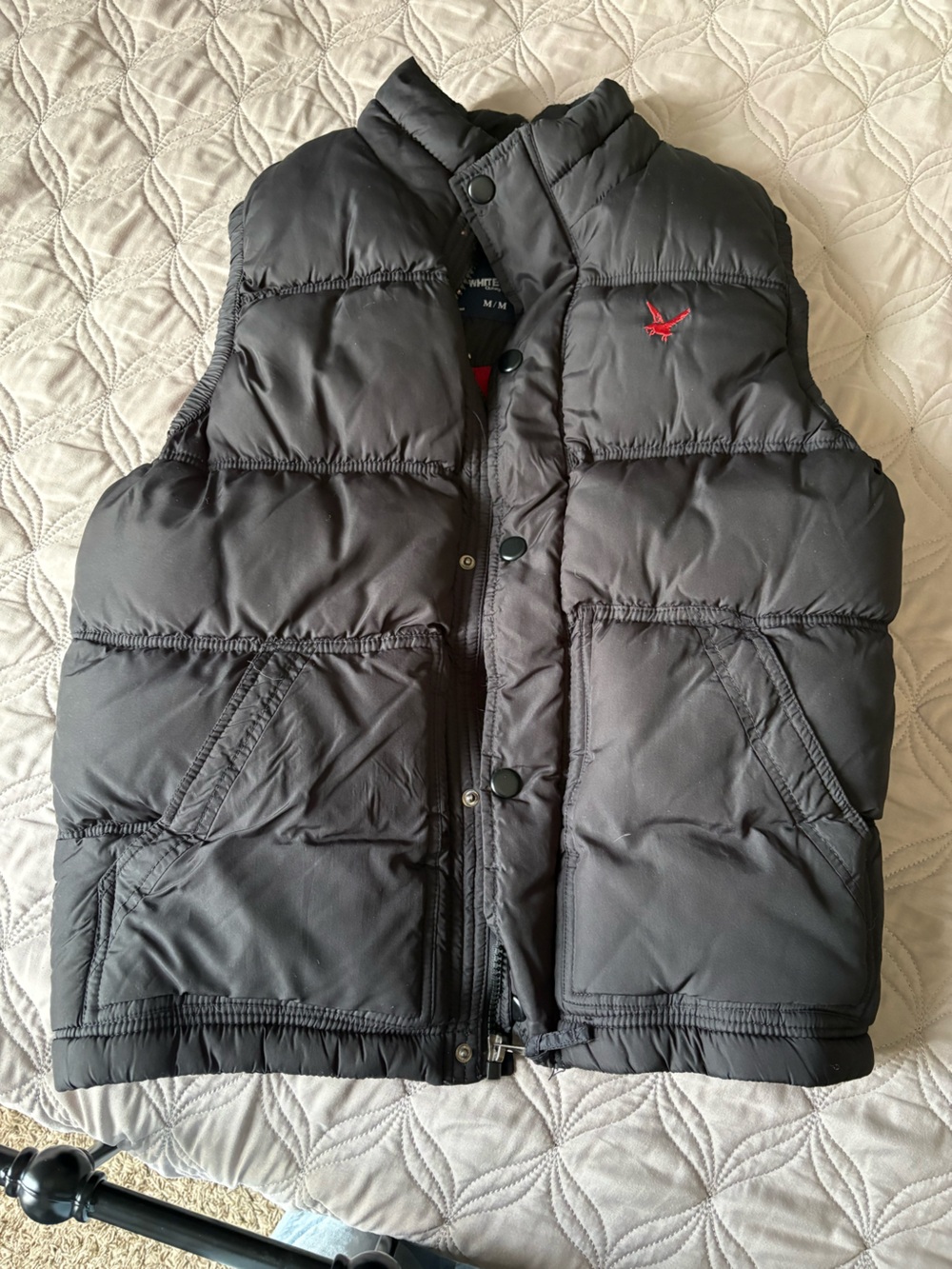 Black Puffer Vest with Red Emblem